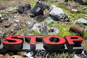 Stop Sign in Trash Pile